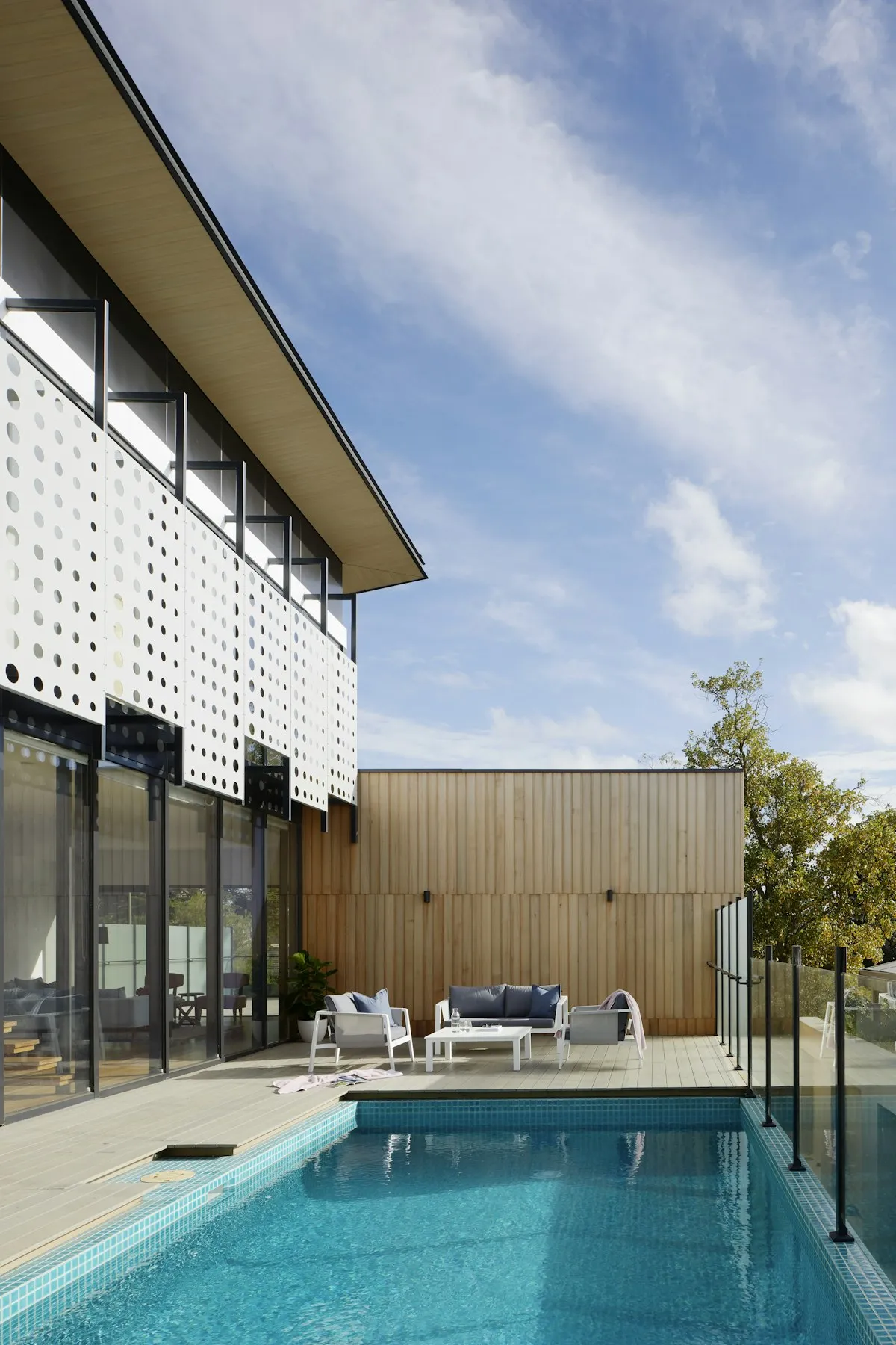 Modern home exterior with pool and outdoor living area